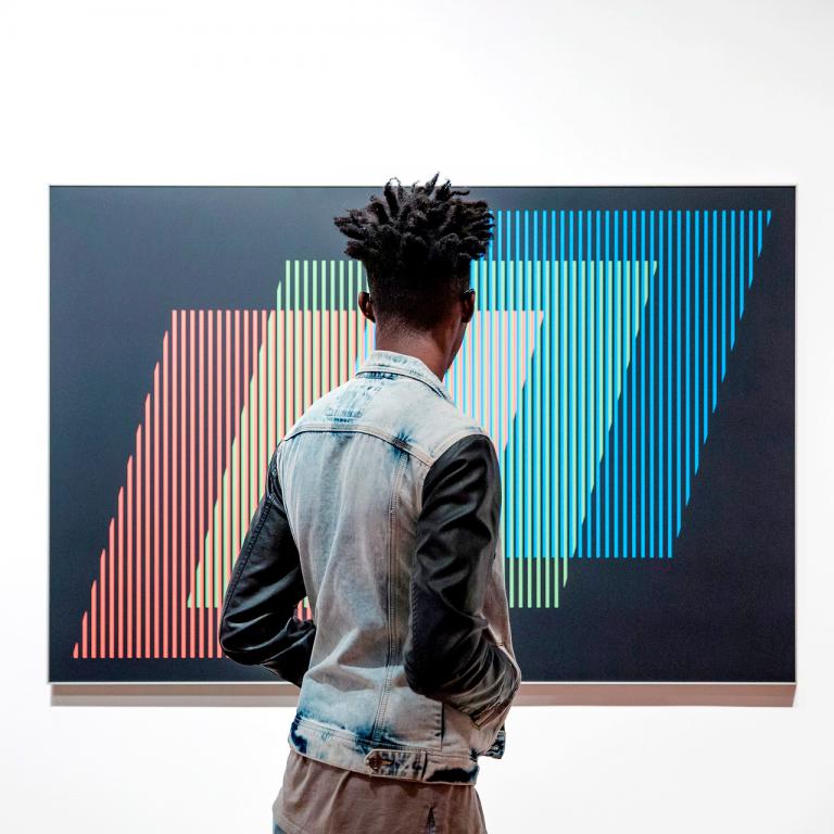 Museum visitor looking at exhibition