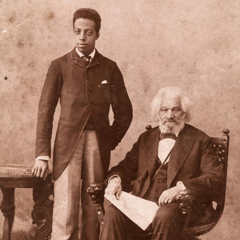Portrait of Frederick Douglass seated with another man