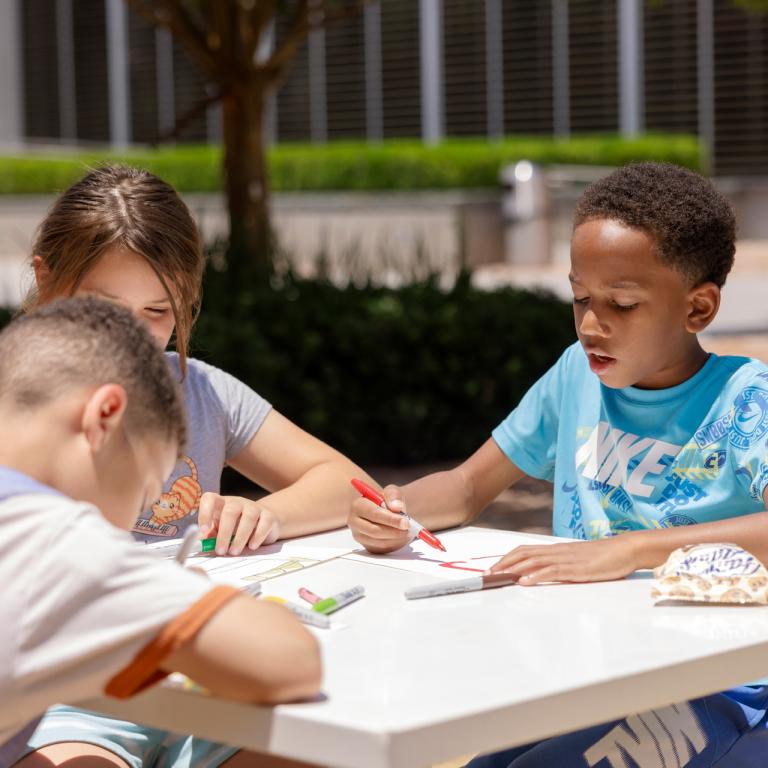 Children work on their own artwork