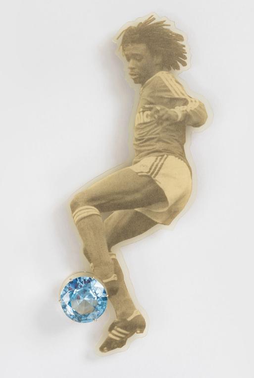Gijs Bakker, "Blinker Brooch" from the "Sportfiguren (Sports Figures)" series, 1988, executed by Tobias van Roojen, gold, aquamarine and PVC-laminated newspaper; 6 1/2 in x 2 9/16 in x 11/16 in.
